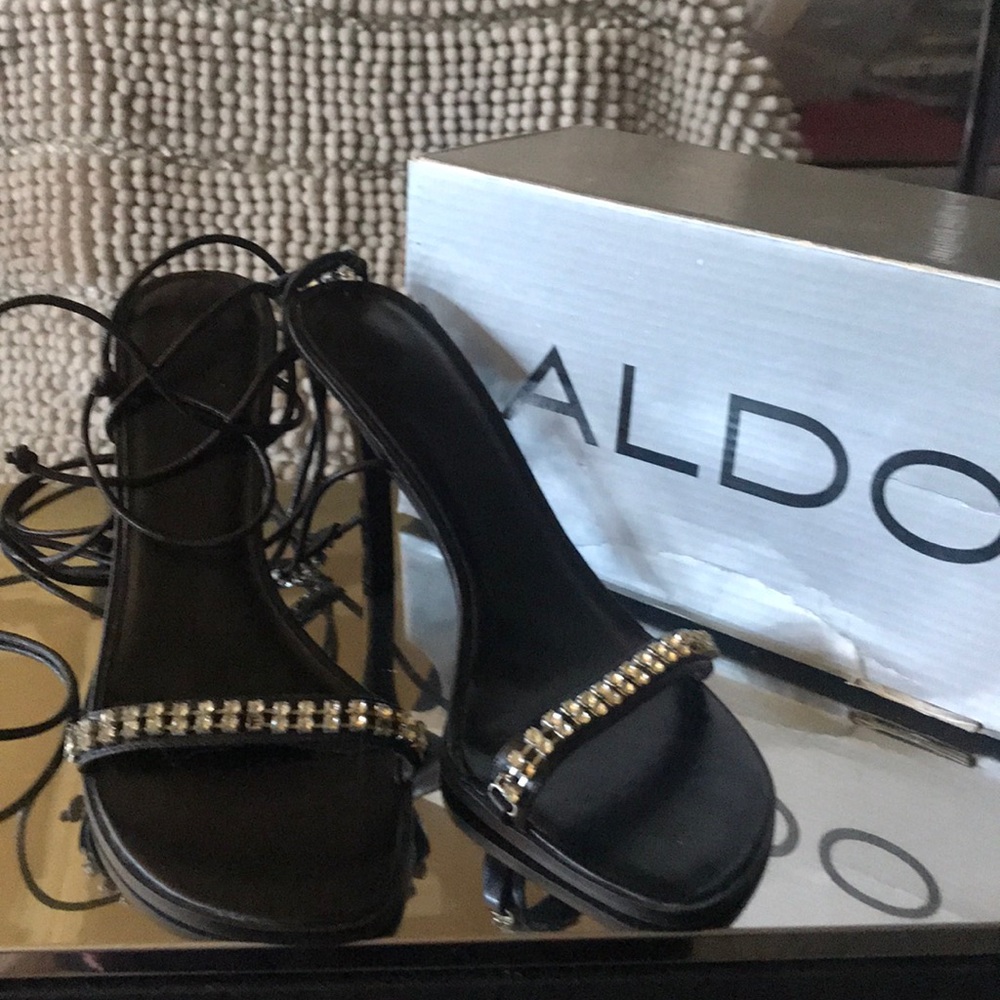 Also strapped black rhinestone heels